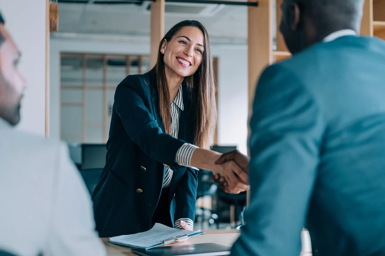 Recruiter welcoming an interested candidate to an interview