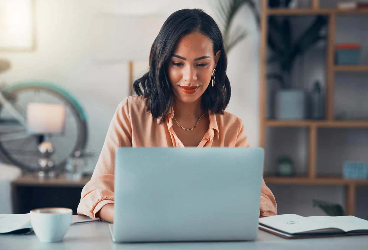 Recruiter reviewing AI-sourced candidates at her laptop